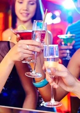 A group of people holding wine glass